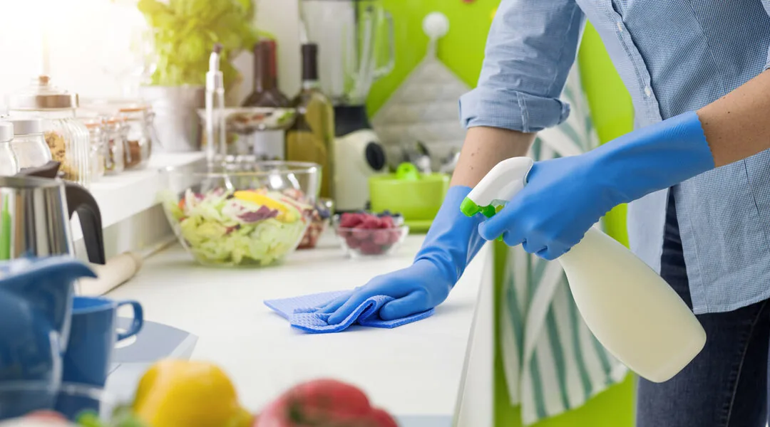CleanPro Plus cleaner wiping down kitchen counters and surfaces